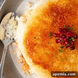 overhead image: spoon on a plate of Persian crispy rice