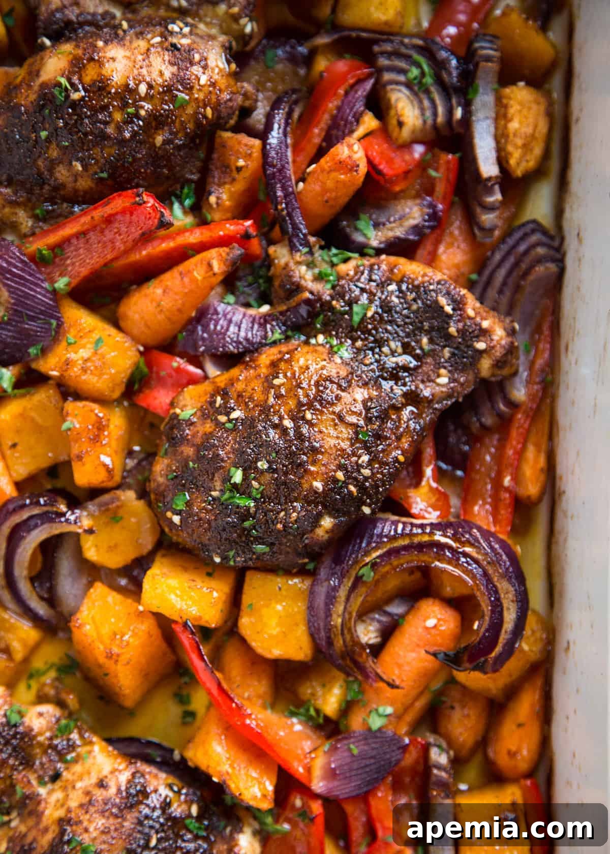 Close-up shot of roasted Moroccan chicken and seasoned lentils on a plate