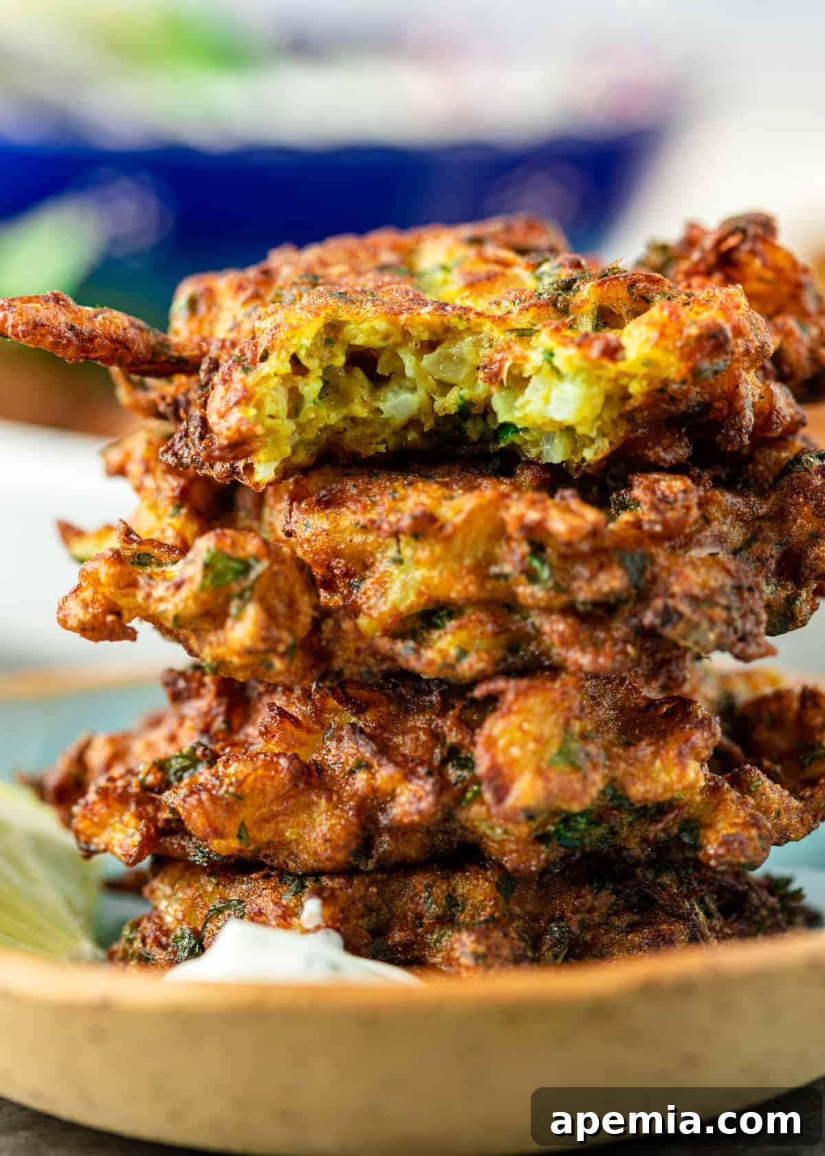 Lemon-Kissed Cauliflower Crisps 3 close up: stack of 4 fried cauliflower patties