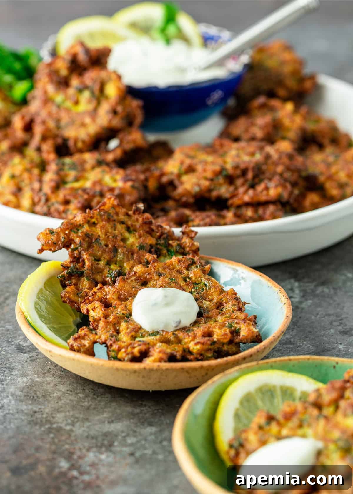 Lemon-Kissed Cauliflower Crisps 6 cauliflower fritters with sauce ready to serve