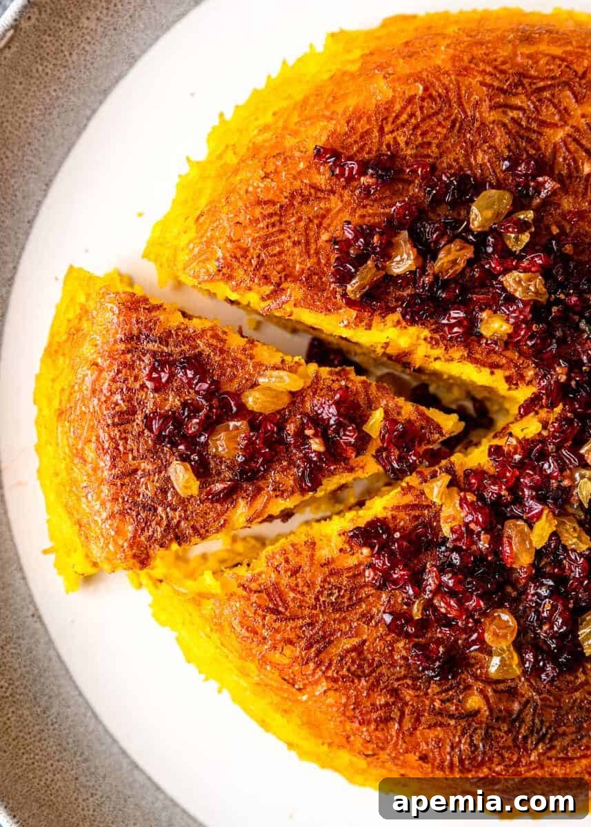 overhead: slice of crispy Persian rice on platter with remaining cake