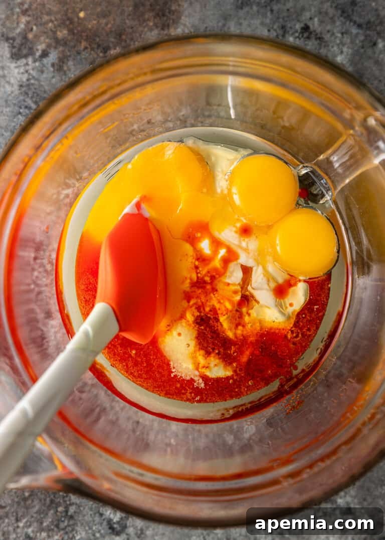 overhead: egg yolks and bloomed saffron in bowl