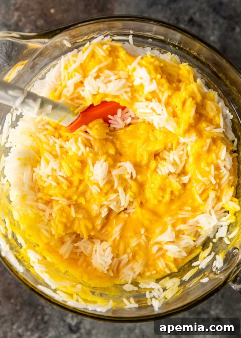 overhead: stirring cooked rice into tachin batter