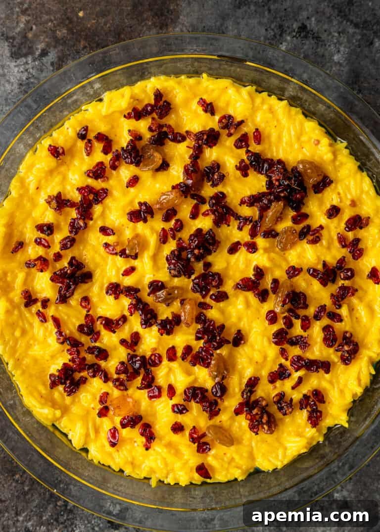 overhead: fruit mixture layer of my tachin recipe added on top of rice