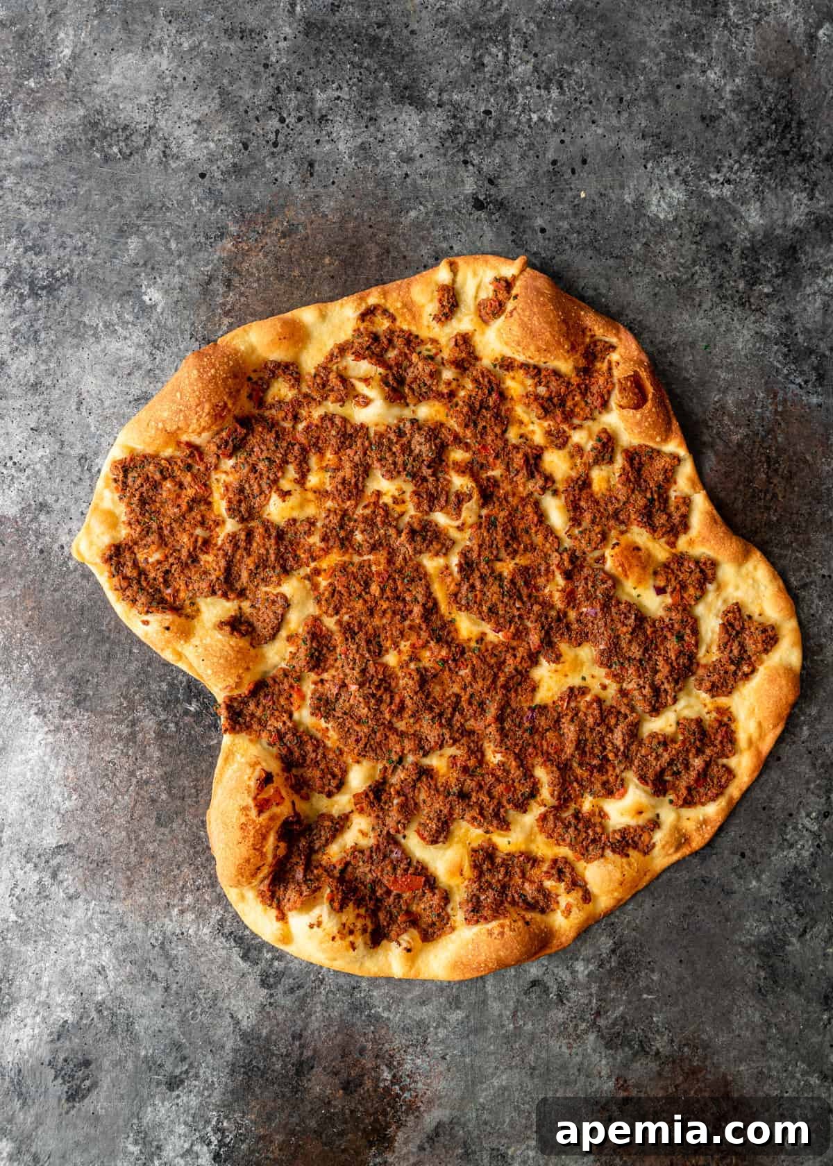 overhead: homemade turkish pizza with crispy, golden crust fresh out of the oven