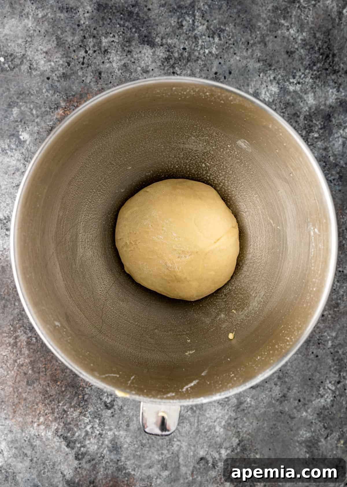 overhead: lachmacun dough in metal mixing bowl