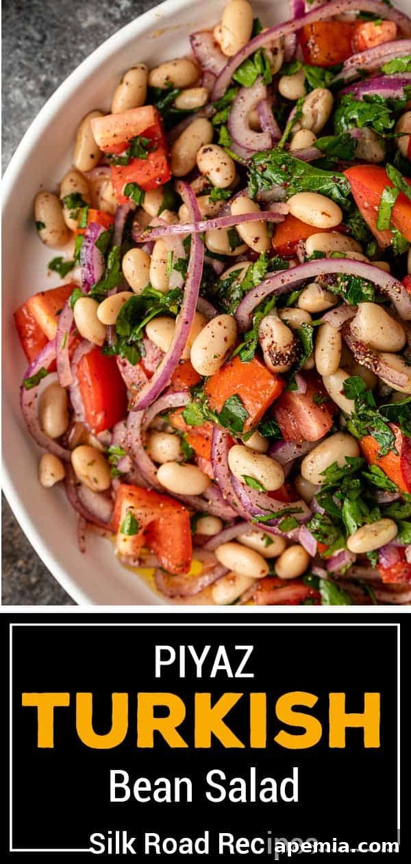 Titled image displaying a beautifully arranged plate of Piyaz Turkish Bean Salad, rich with white beans, tomatoes, red onions, and fresh herbs, ready to be served.