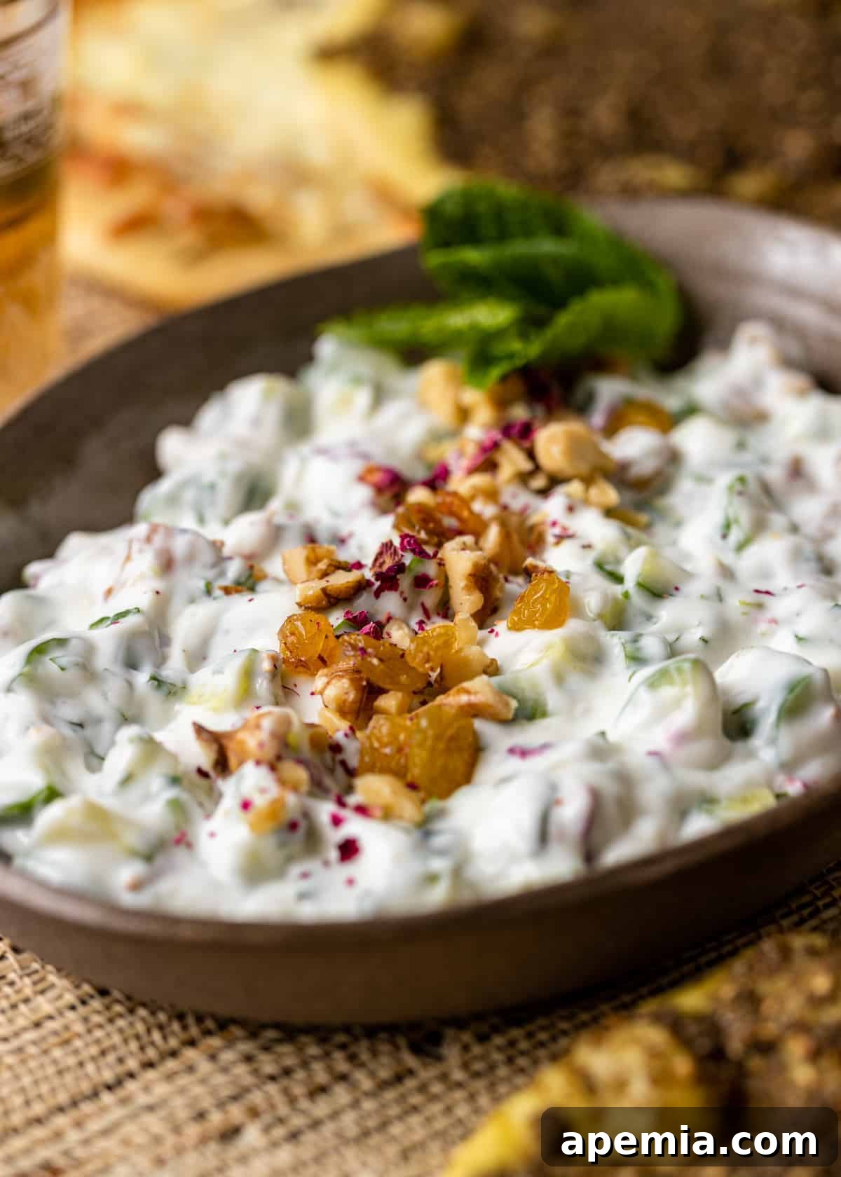 Refreshing Persian Mast O Khiar Cucumber Yogurt 6 closeup: persian cucumber salad in brown bowl