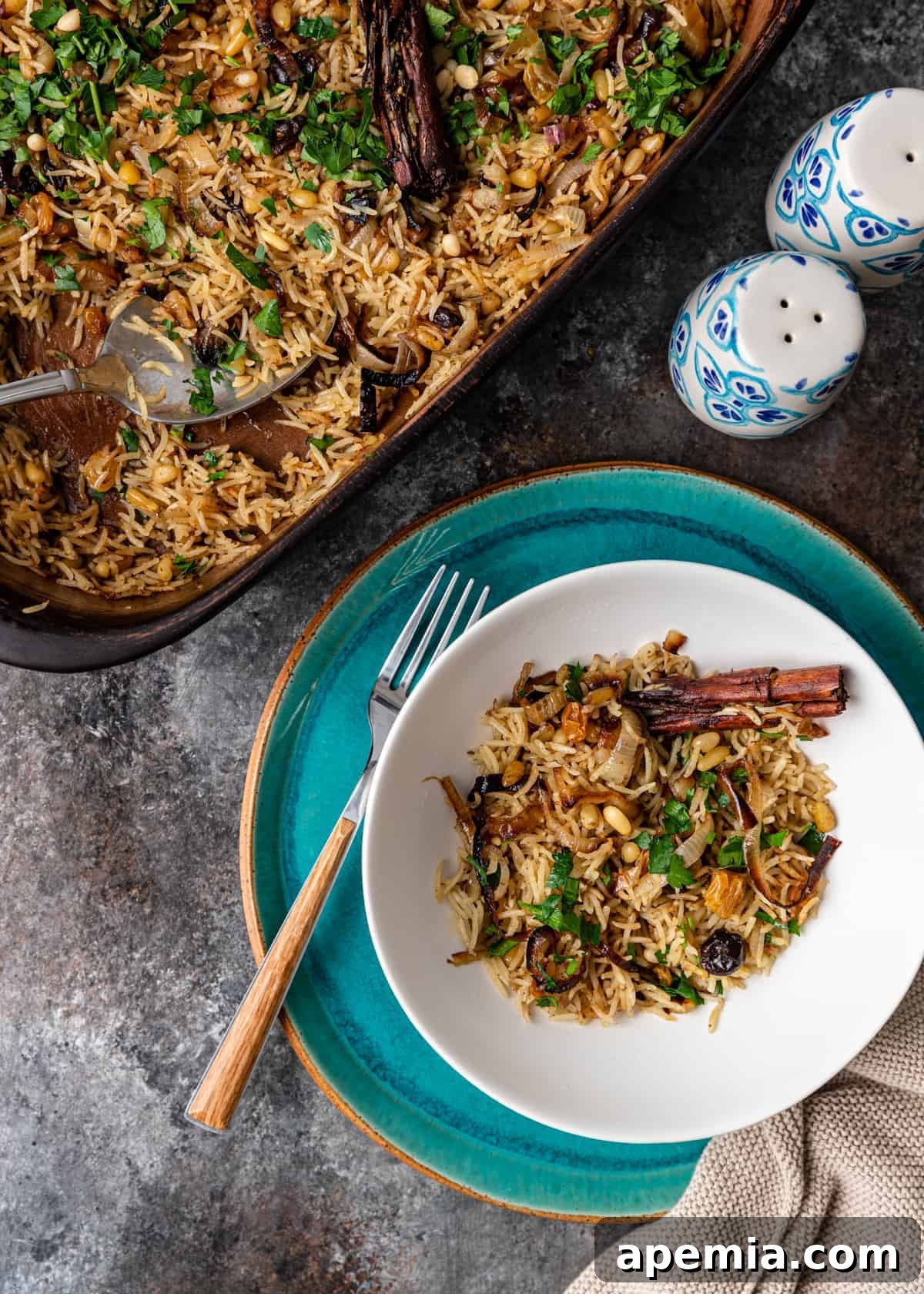 overhead: Middle Eastern rice pilaf recipe in casserole dish and white bowl