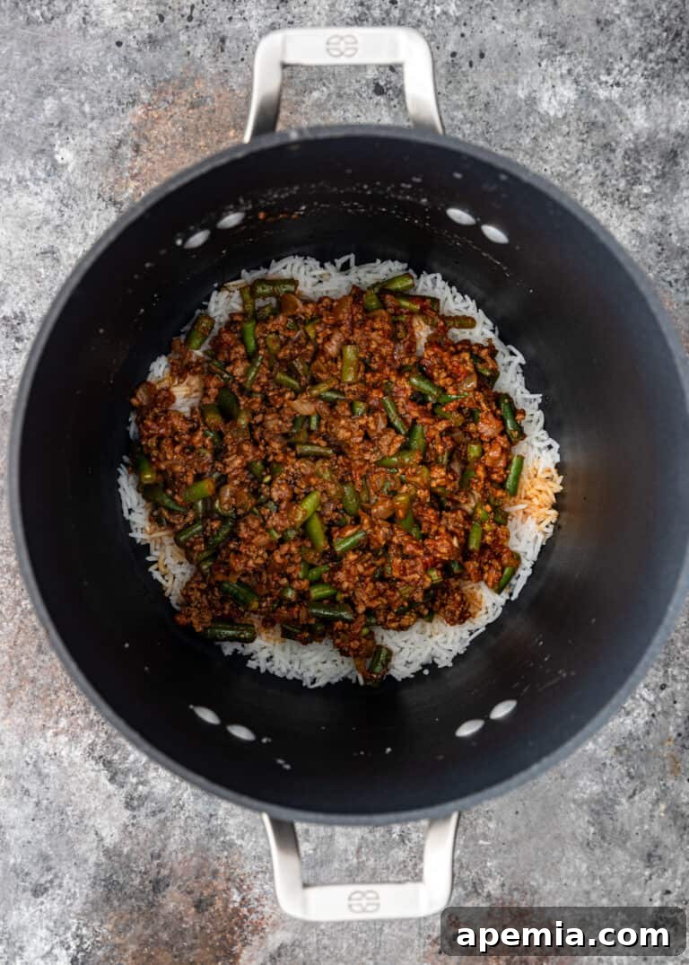 overhead process shot: cooking ground beef rice in large pot