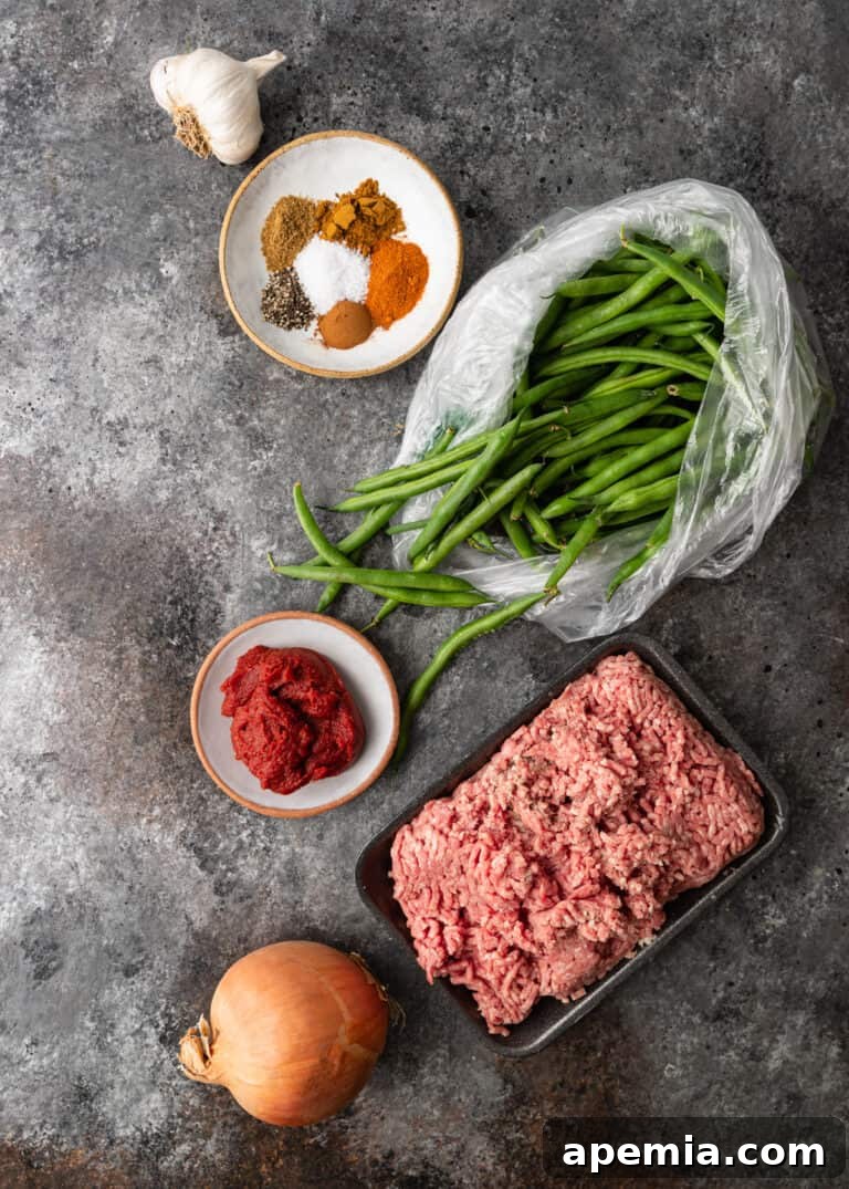 overhead: ingredients for lubia polo recipe on gray marble counter