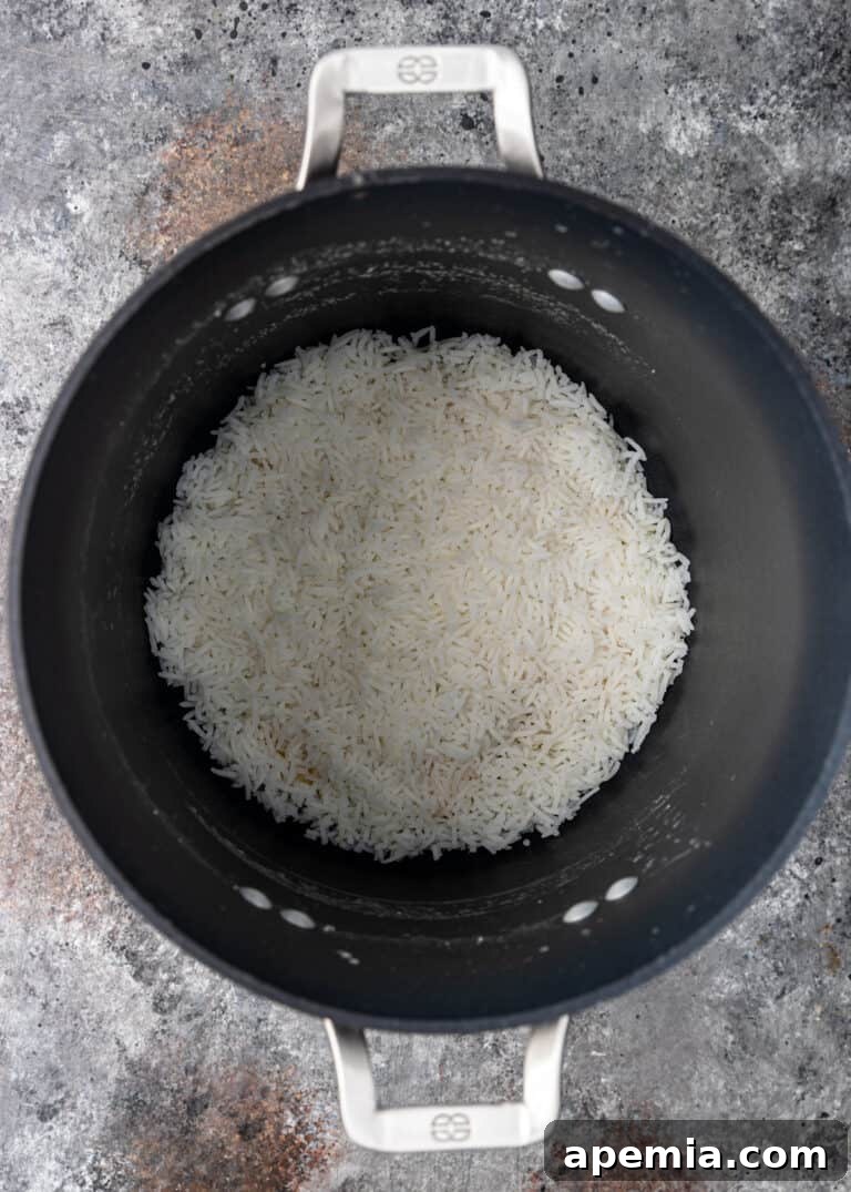 overhead process shot: Jasmine rice in large pot for persian green bean rice