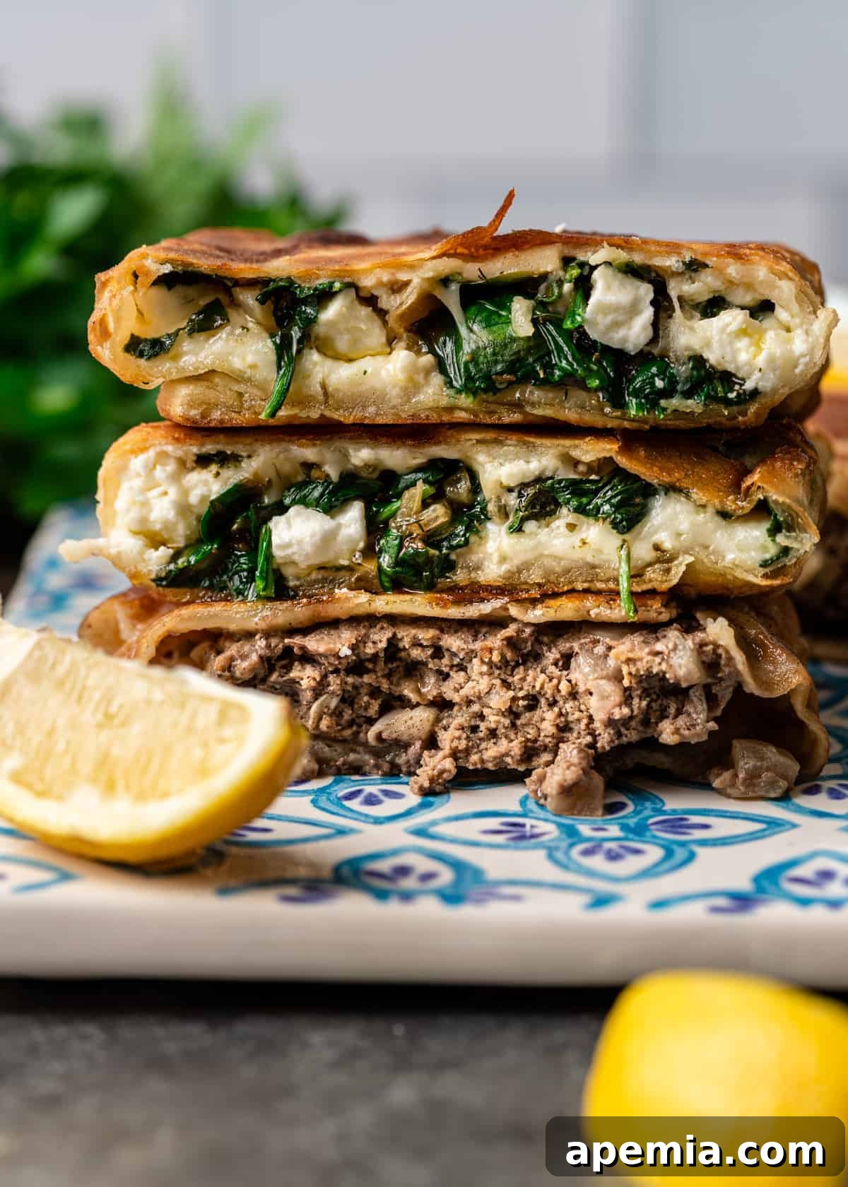 Side view of homemade Gozleme with various fillings, including ground lamb and potatoes, and spinach and feta.