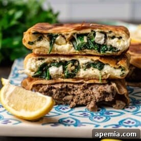 Three Gozleme (Turkish Stuffed Flatbread) stacked on a decorative square plate.