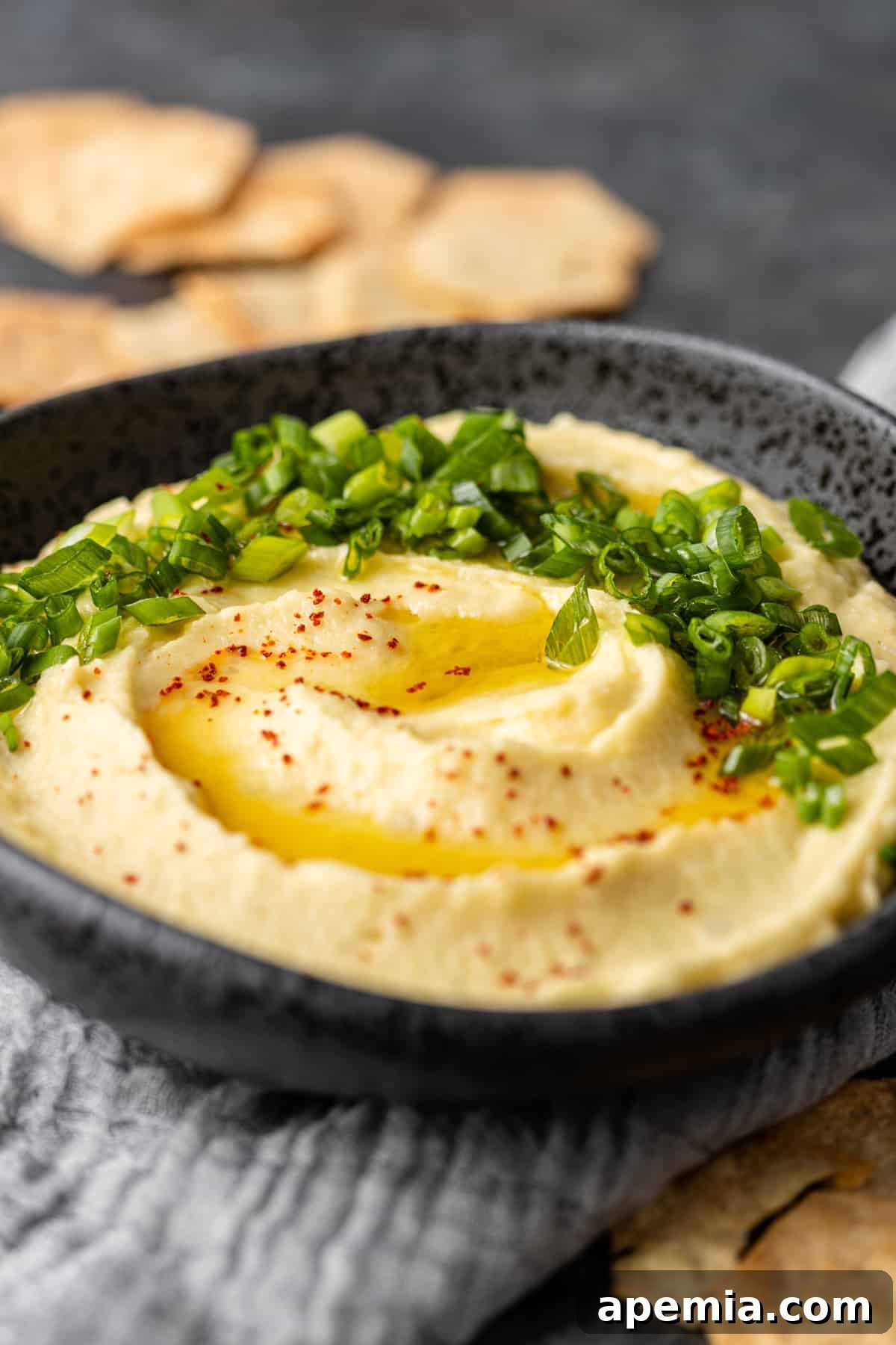 black bowl of creamy Skordalia dip