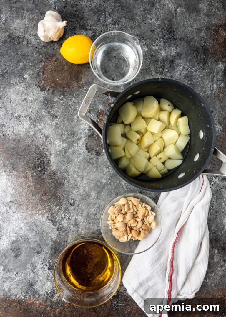 overhead: bowls of ingredients to make potato and garlic dip recipe