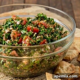 Glass salad bowl filled with fresh tabbouleh