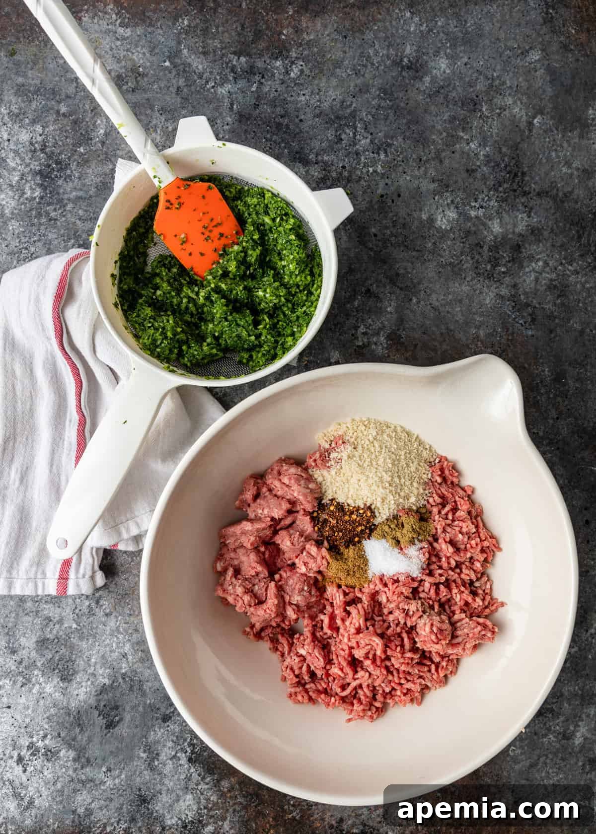 A collection of ingredients neatly arranged in mixing bowls, showcasing the fresh herbs, spices, and ground meat ready to be combined for a delicious kefta recipe.