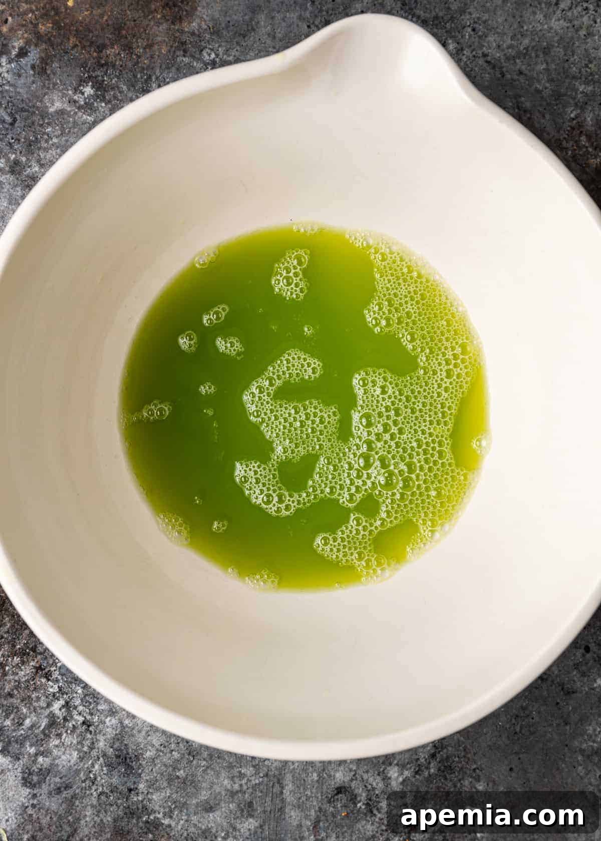 green liquid in large white bowl