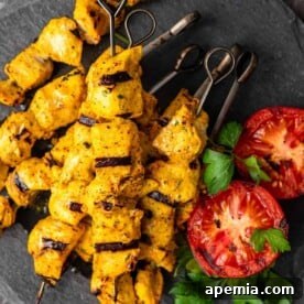 Joojeh kabob on metal skewers, perfectly grilled and ready to serve.