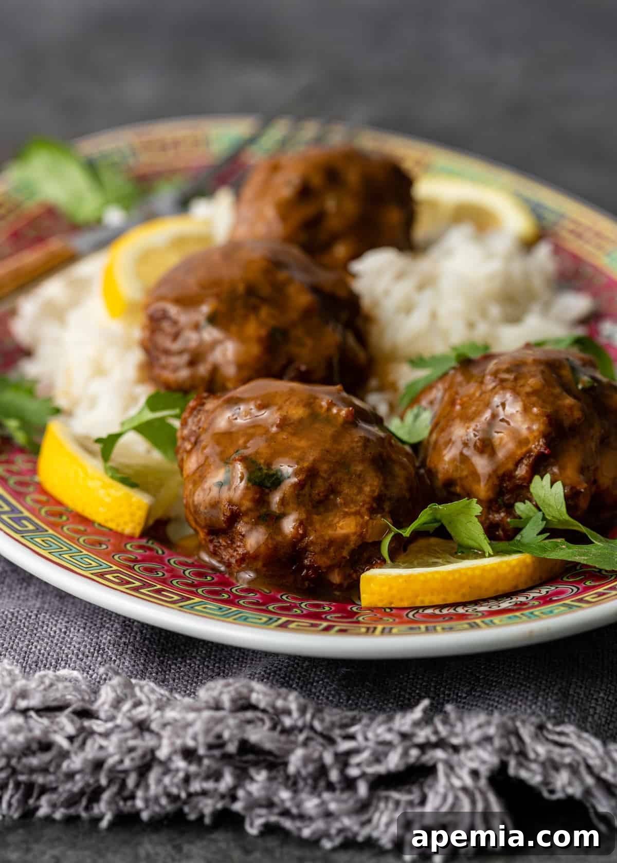platter of chicken meatballs served over rice