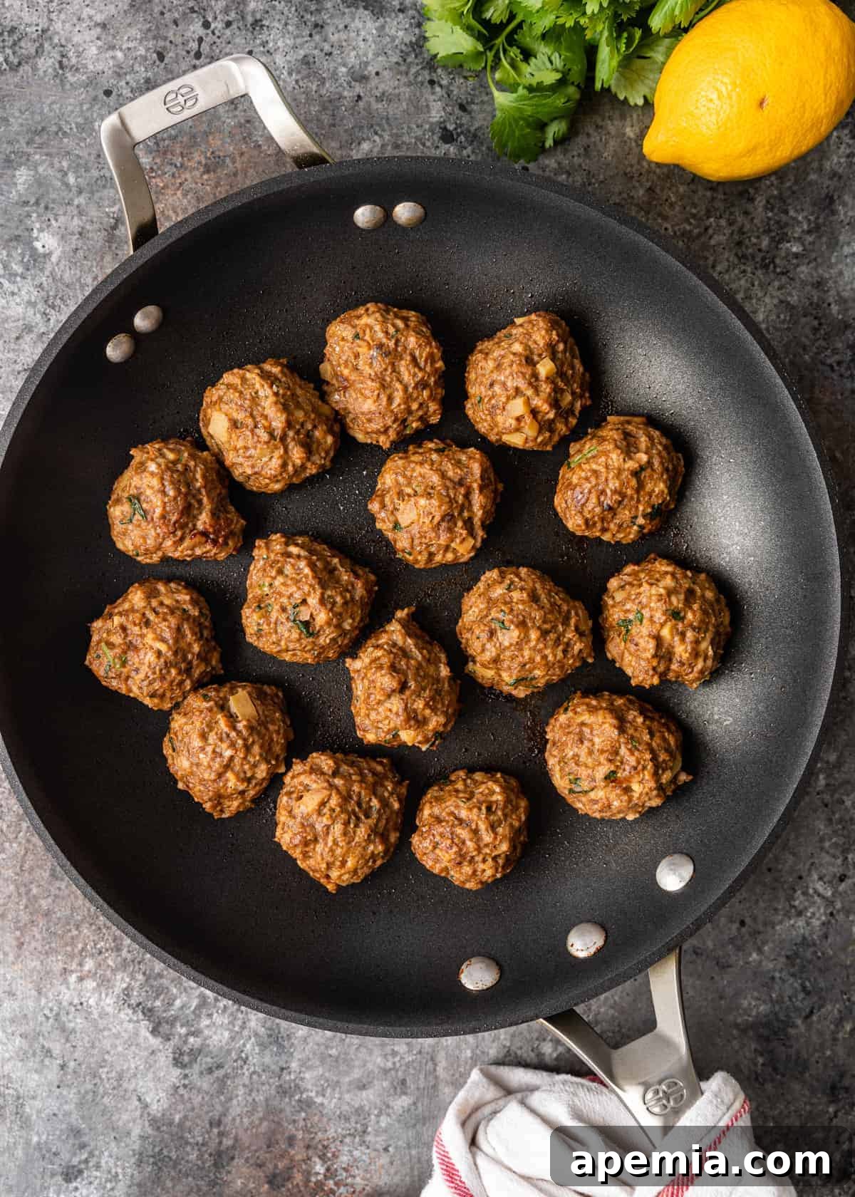 overhead: steamed lemon chicken meatballs in skillet