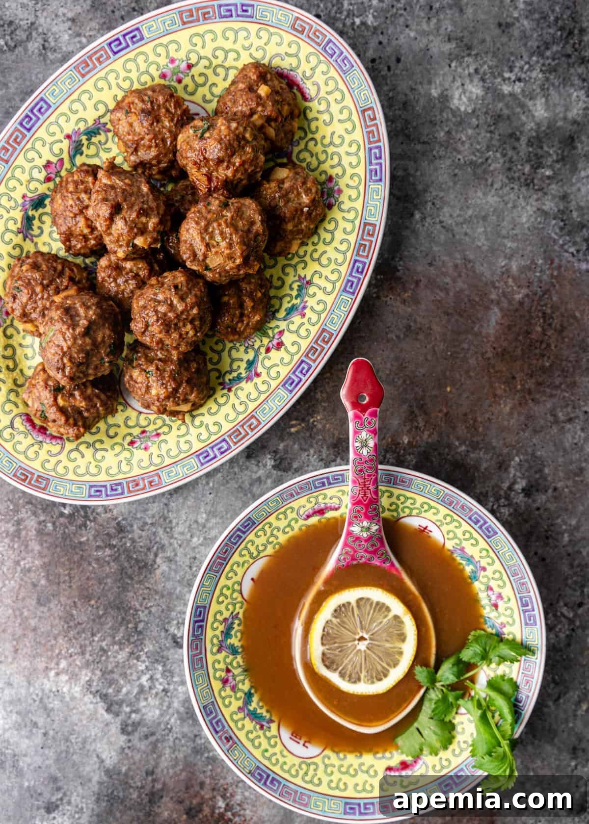 dish of creamy lemon sauce next to platter of chicken meatballs