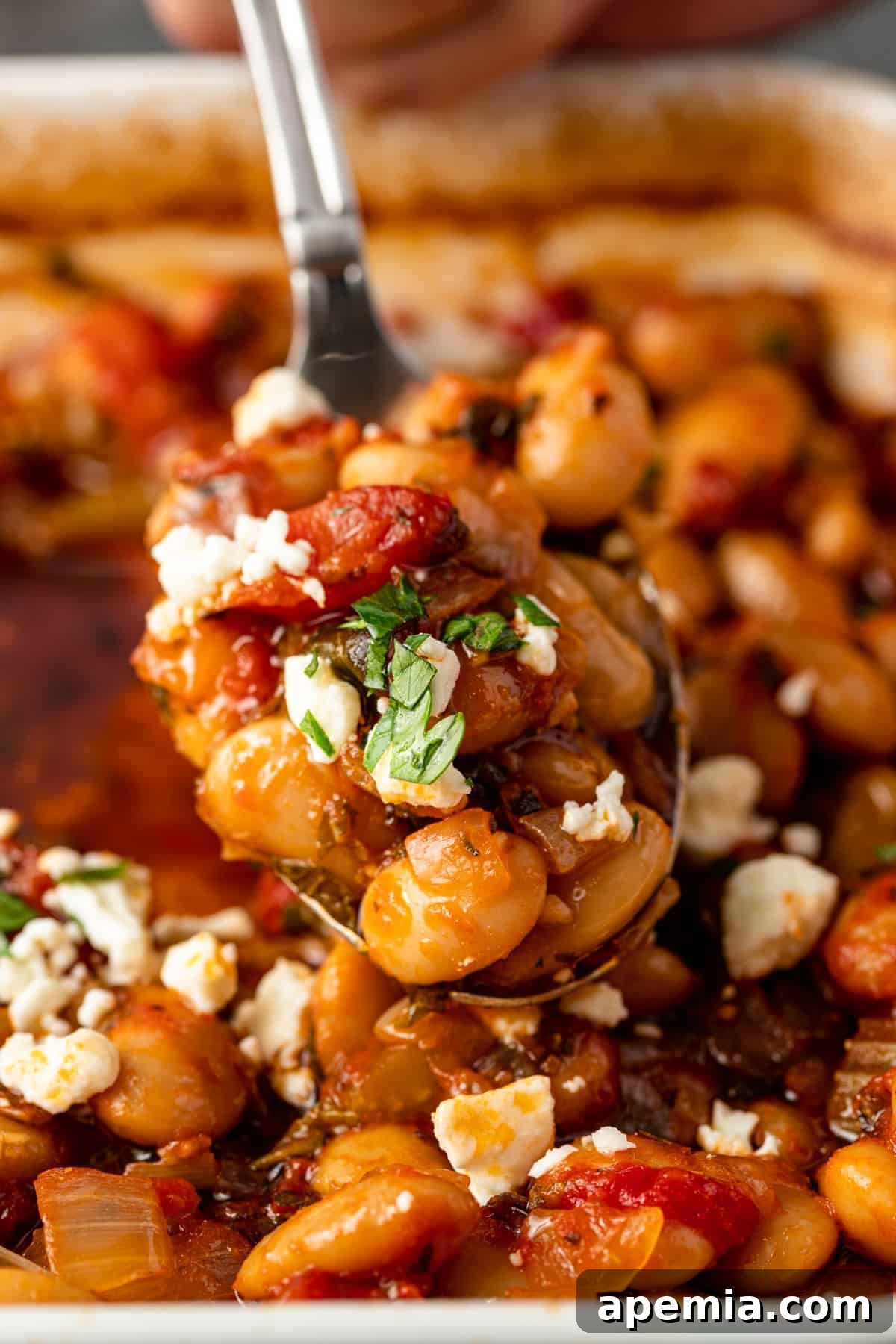 spoonful of healthy side dish of gigantes