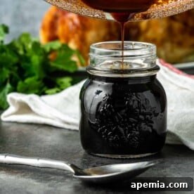 A small portion of the pineapple teriyaki sauce, showcasing its vibrant color and smooth texture in a bowl.