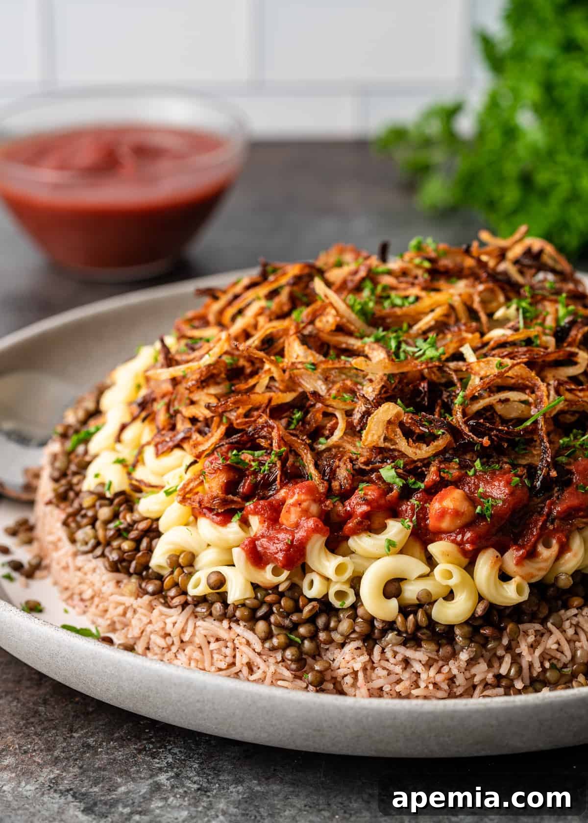 side view: a heaping plate of layered koshari