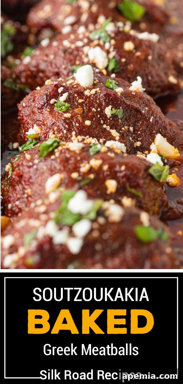 Extreme close-up titled image of baked Soutzoukakia, showcasing the texture and rich sauce