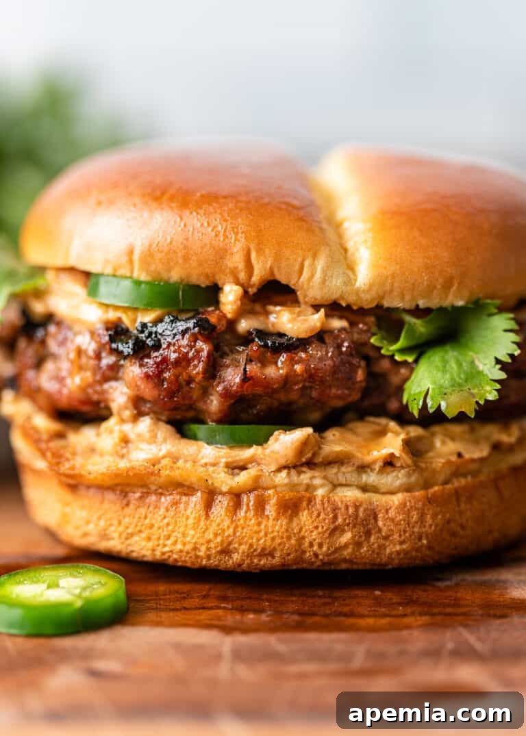 grilled pork burger on brioche bun