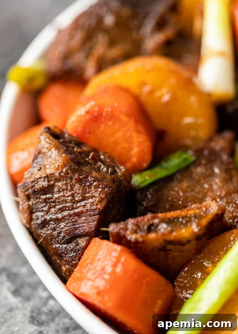 overhead serving of galbi jjim in white bowl