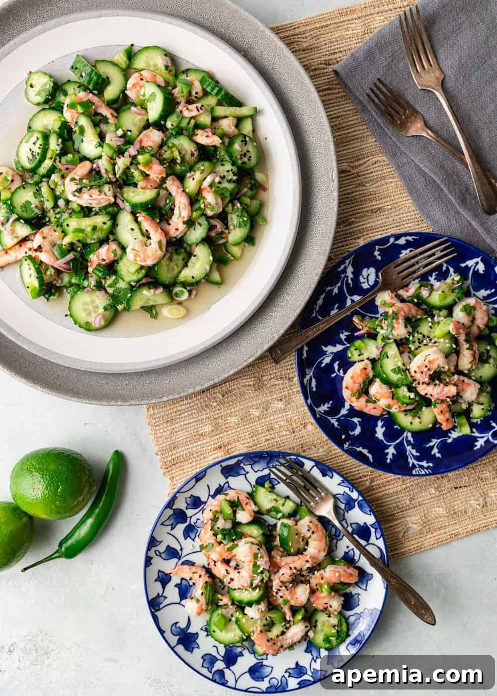 overhead: 3 plates of marinated cucumber salad with shrimp