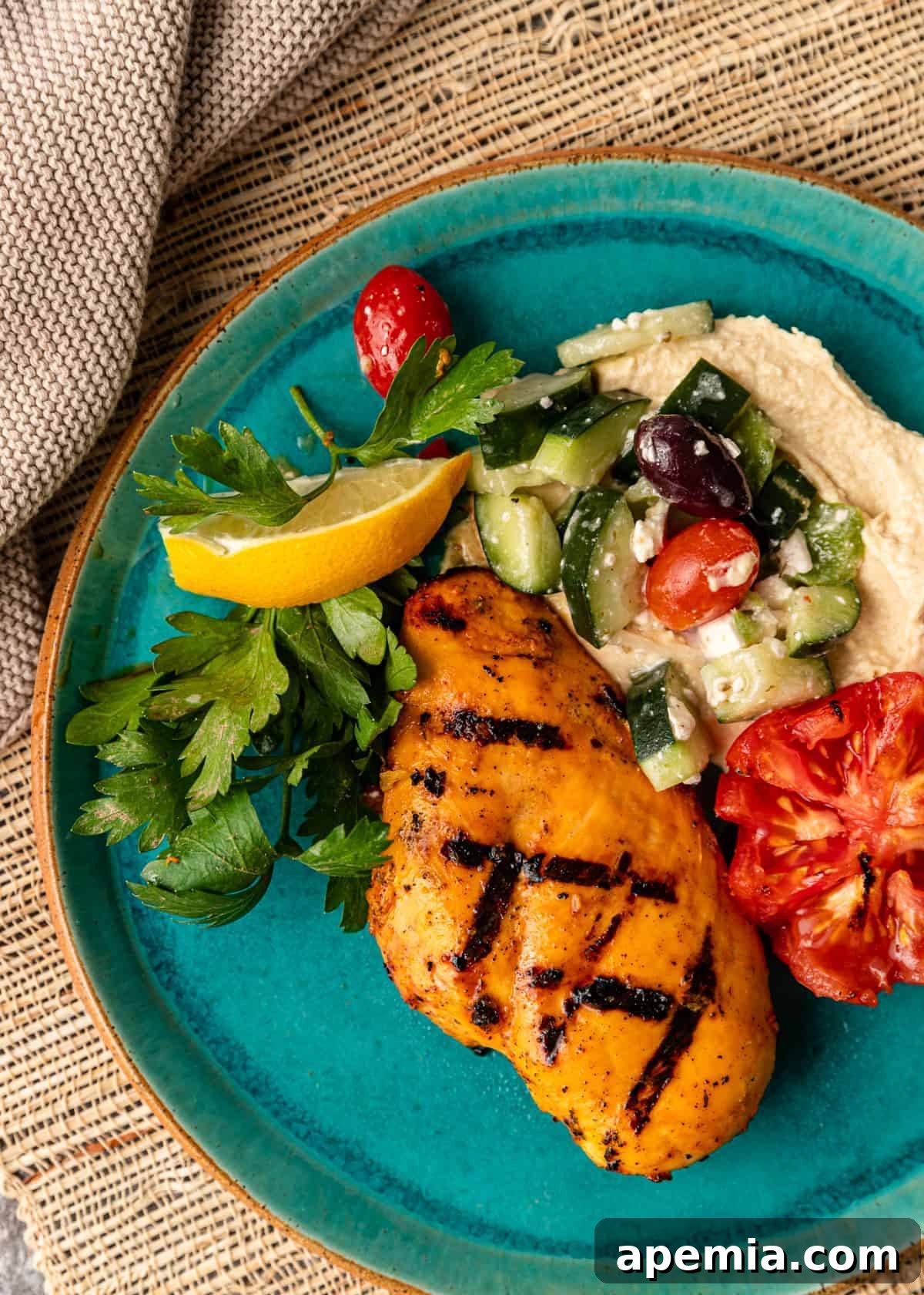 Overhead view of a beautifully plated serving of saffron chicken with fresh vegetables, ready to be enjoyed.