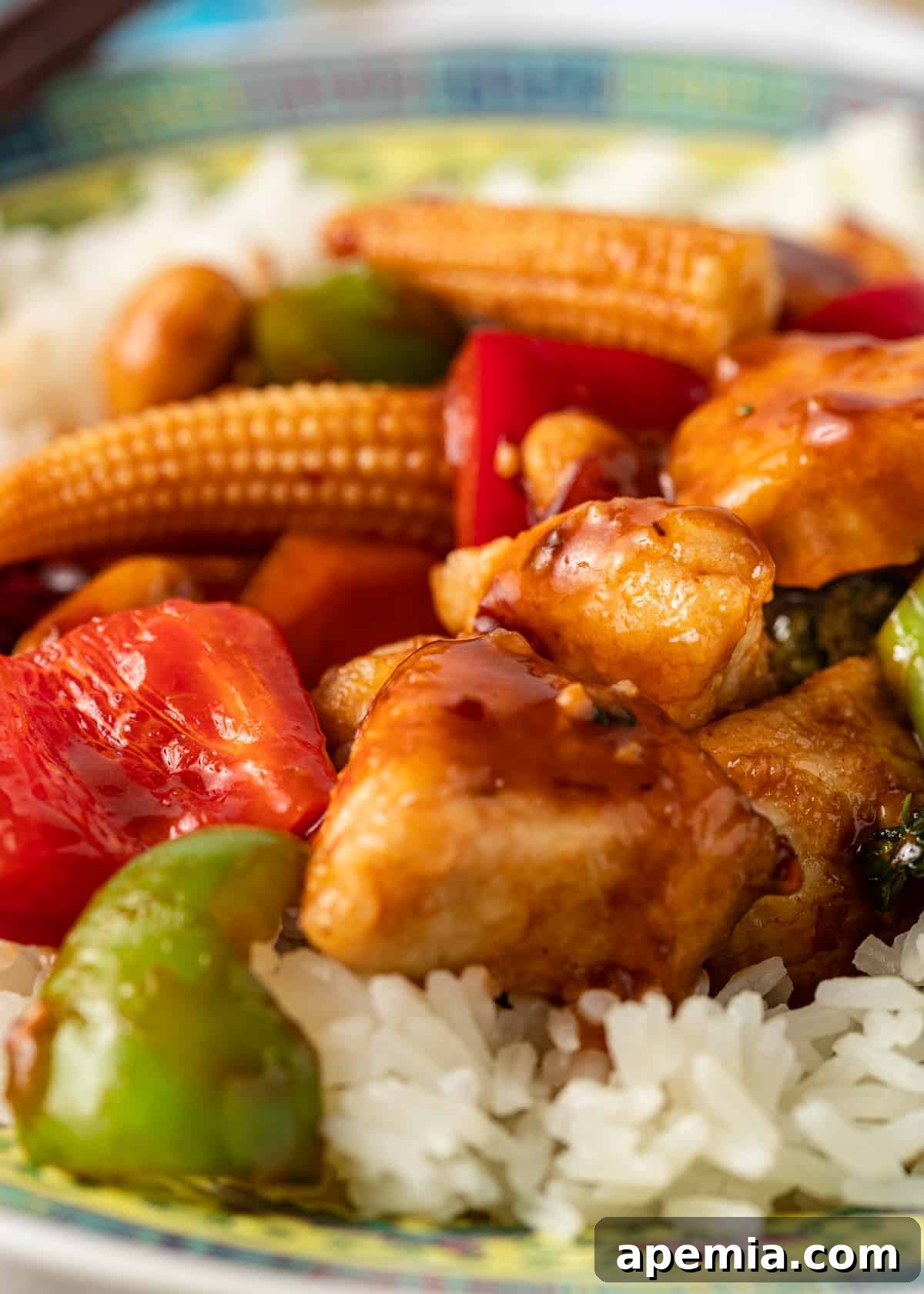 Extreme closeup of crisp vegetables perfectly tossed in a rich, spicy Hunan sauce