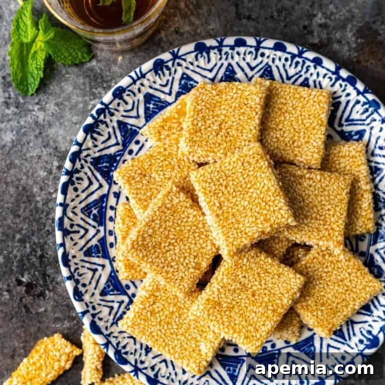 overhead: square of sesame snaps on blue and white plate