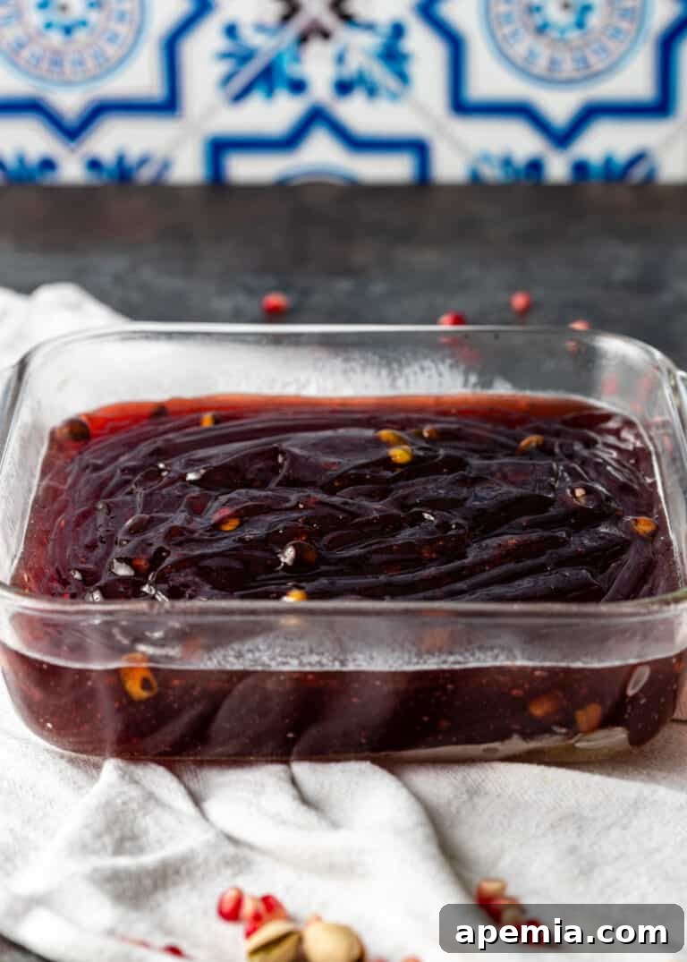 The pomegranate Turkish Delight base evenly spread in the pan, cooling.