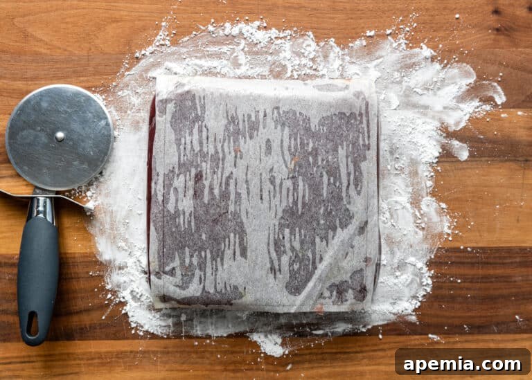 The Turkish Delight block covered with parchment paper, ready to be flipped over.