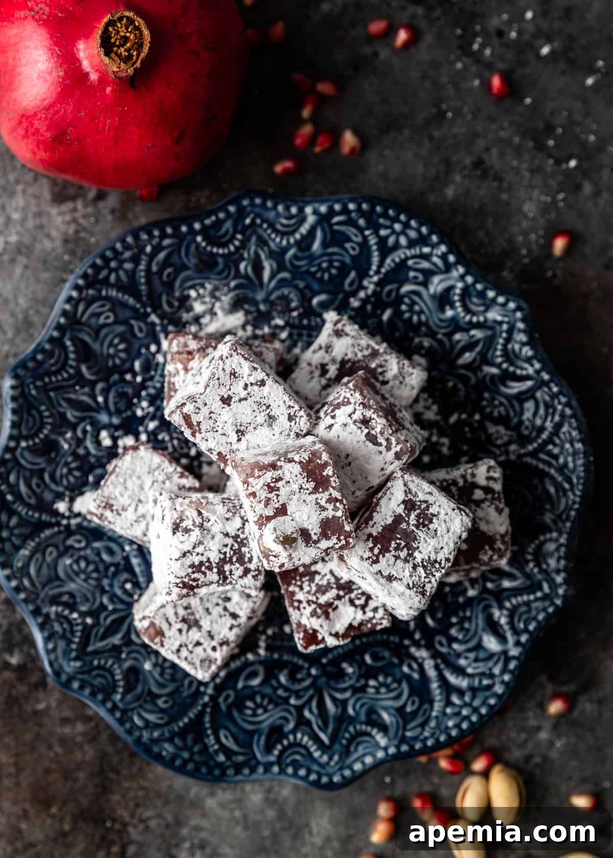Overhead shot of a beautiful platter of homemade pomegranate pistachio Lokum candies, perfect for holidays.