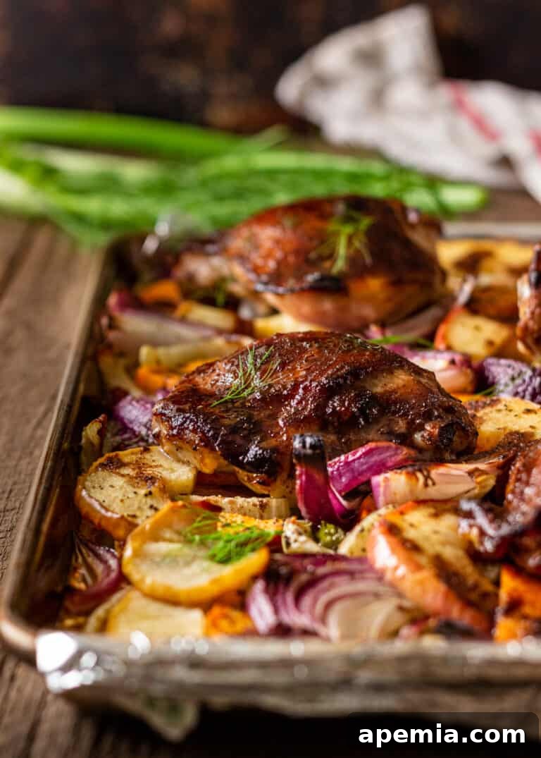 chinese roast chicken and vegetables cooking on sheet pan