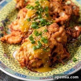 close up of chicken egg foo young on platter