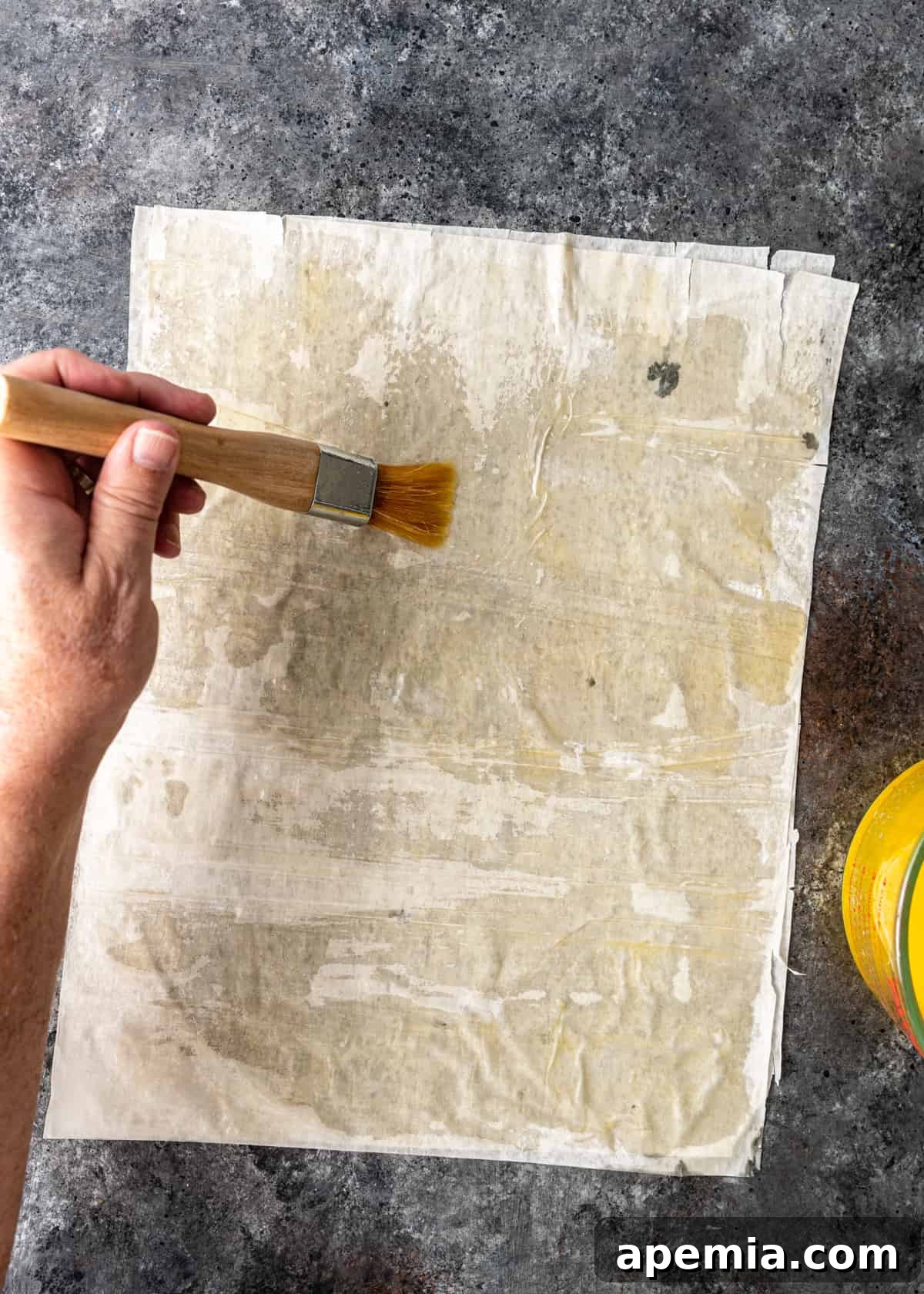 brushing butter on filo sheet