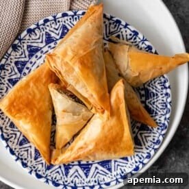 greek spinach pie phyllo appetizers on blue and white plate