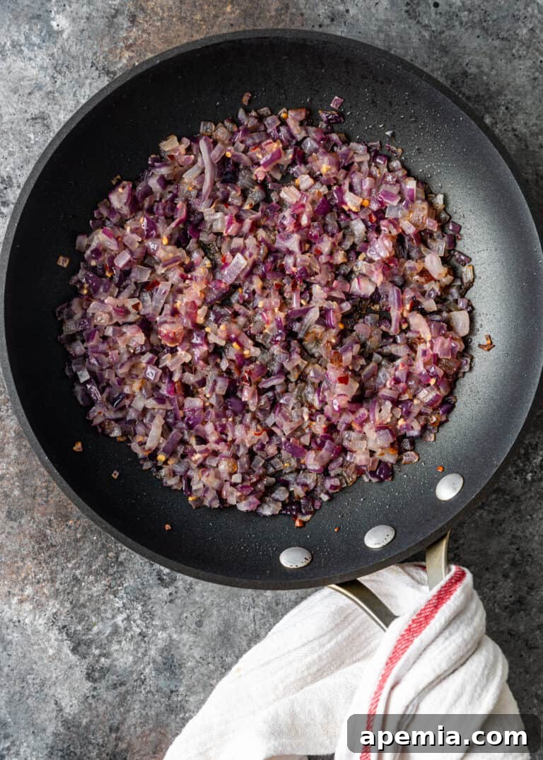 overhead: sautéing onion and garlic