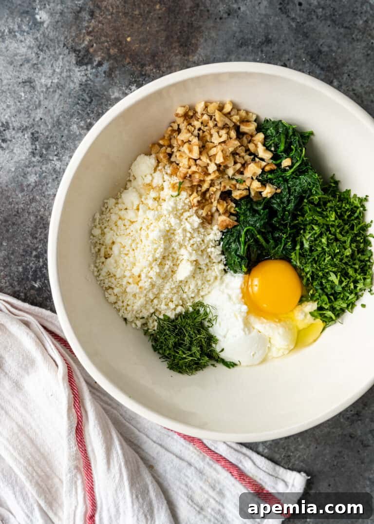 overhead: mixing feta, yogurt, egg, herbs, and nuts