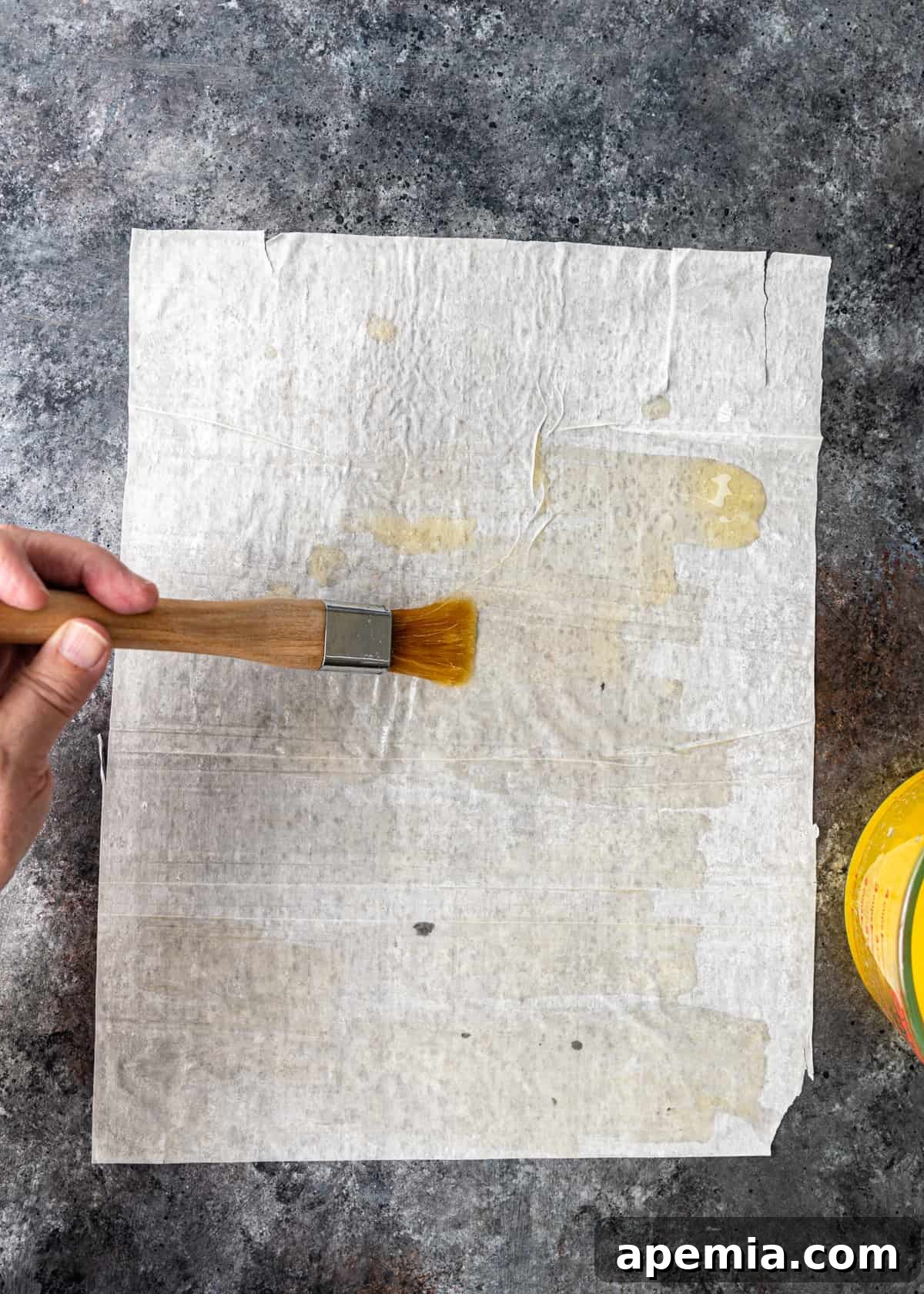 brushing butter on filo sheet