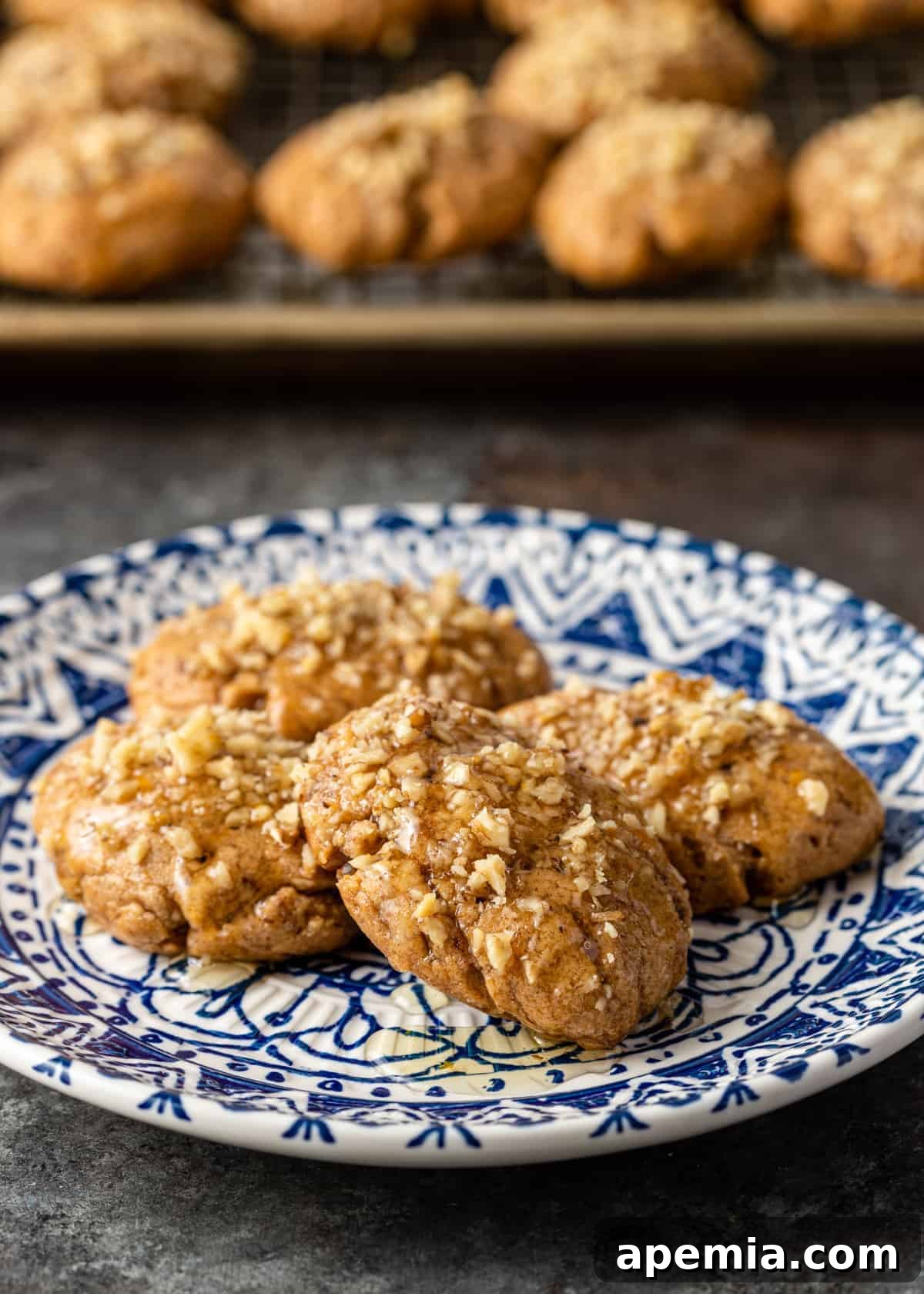 A festive platter piled high with golden Melomakarona cookies