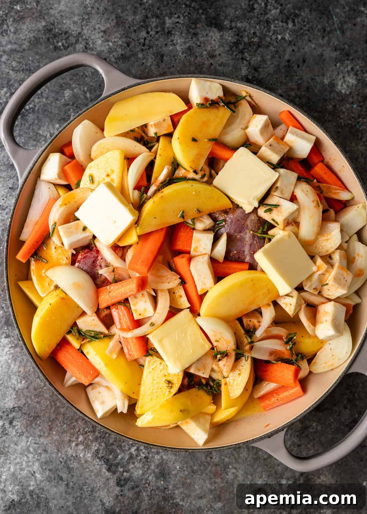 overhead process shot: cut vegetables in dutch oven