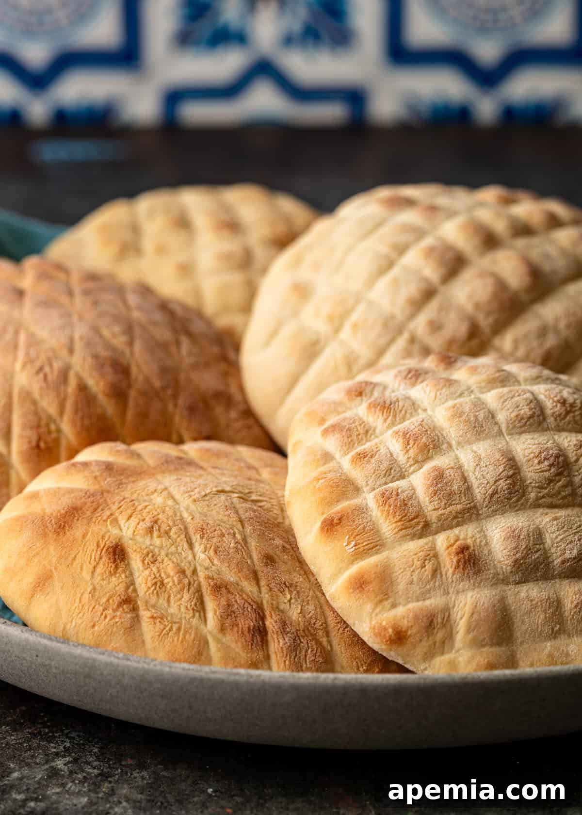 Classic Balkan Flatbread Lepinja 13 closeup side view: bowl of lepinja